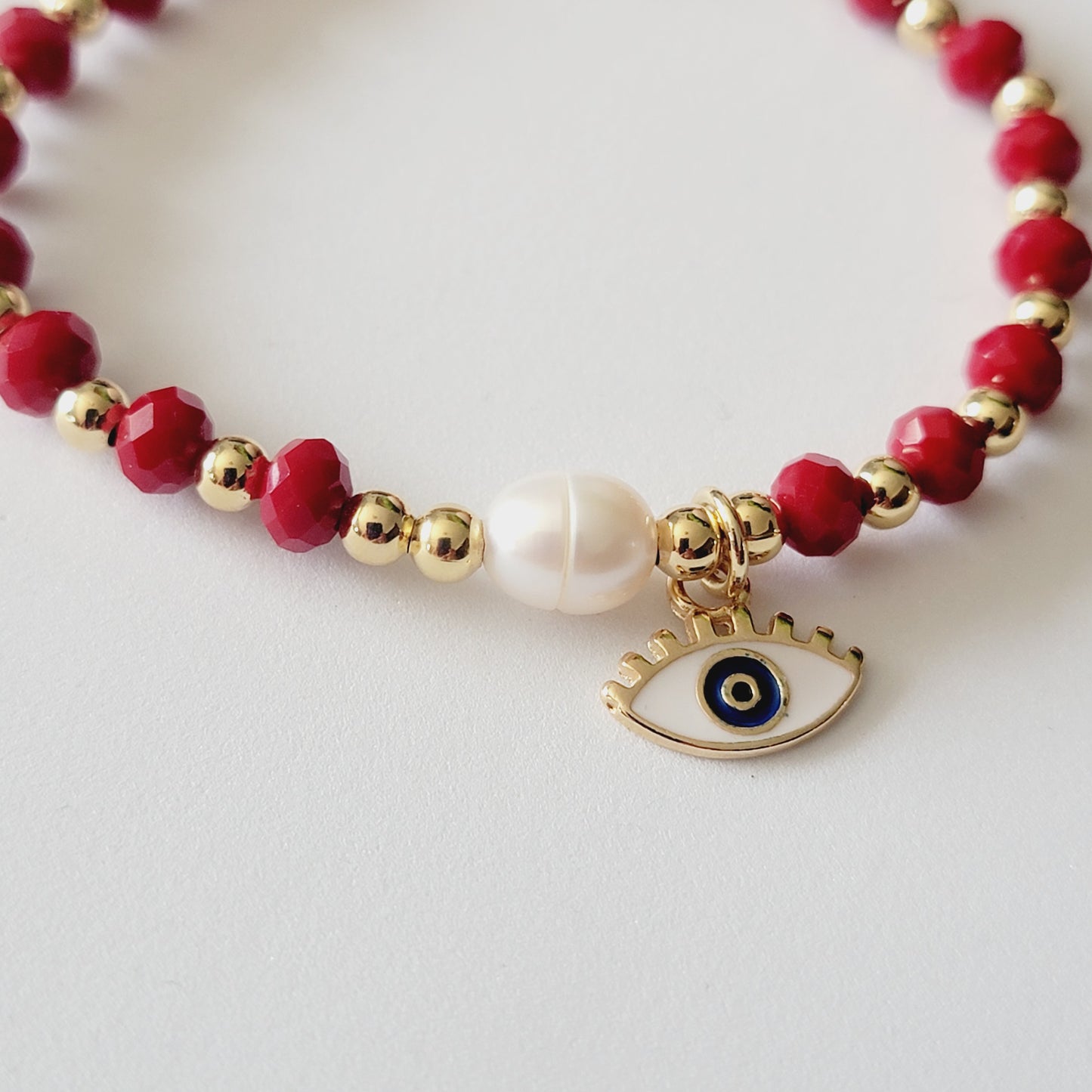 Red Crystal Bracelet with Small 18k Gold-filled Beads, White Evil Eye Charm, and Freshwater Pearl